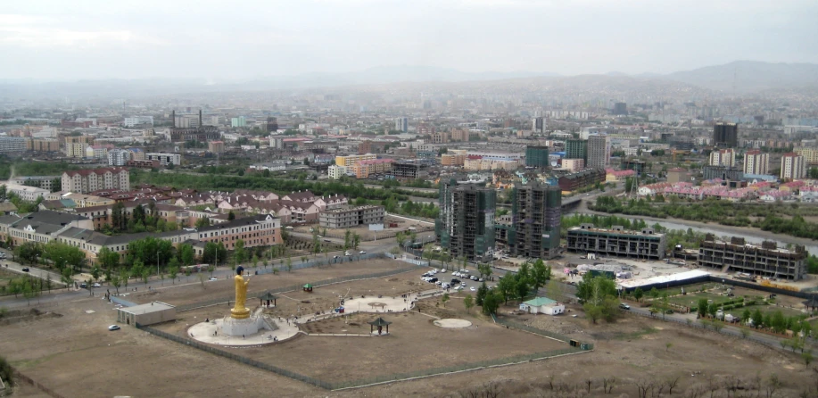 an aerial view of a city with buildings and buildings in the background