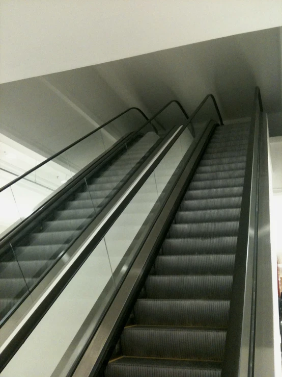 an escalator with a set of moving stairs