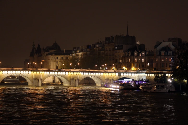 a bridge spanning a city filled with traffic