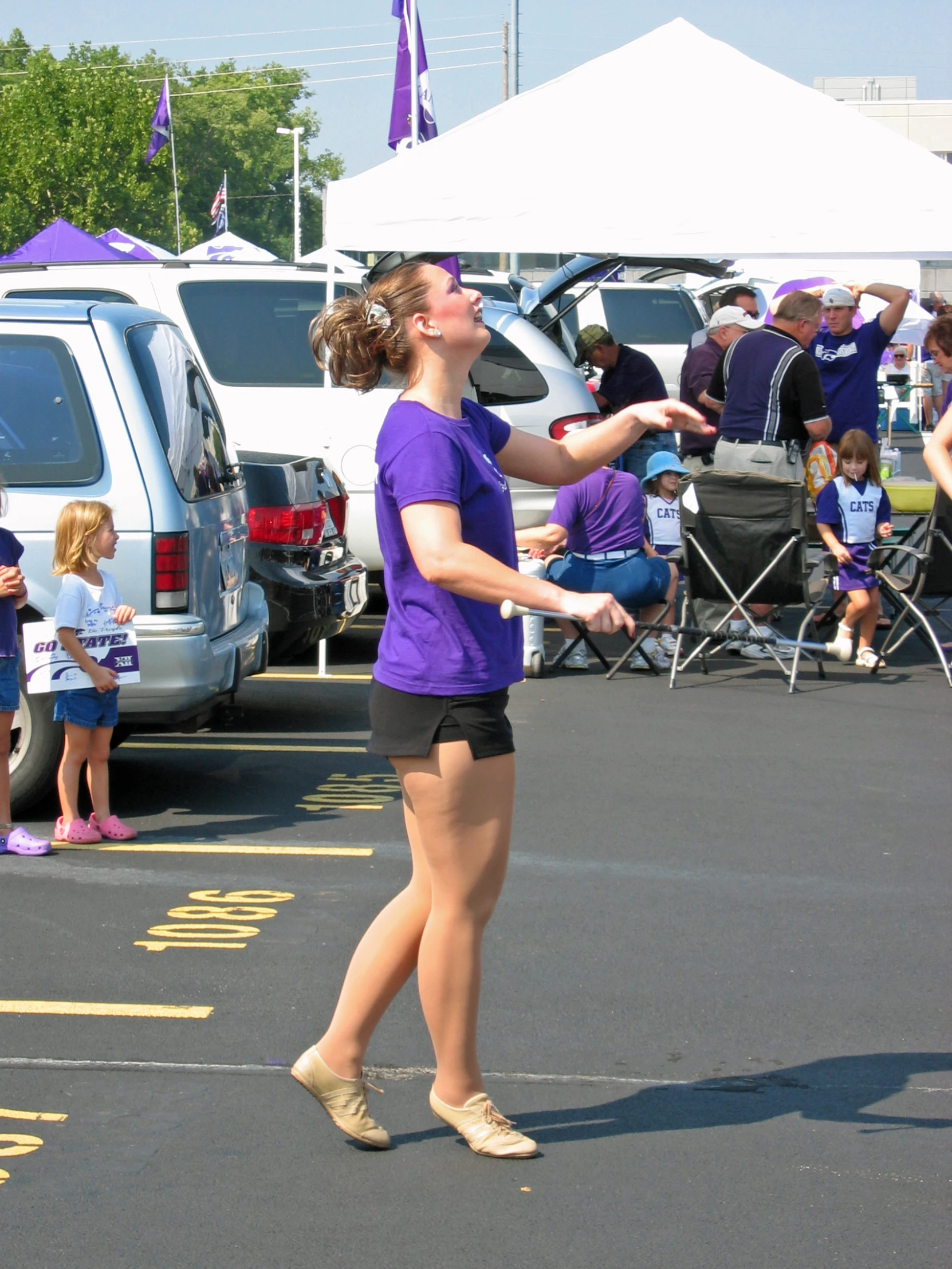 the lady is practicing how to hit the frisbee