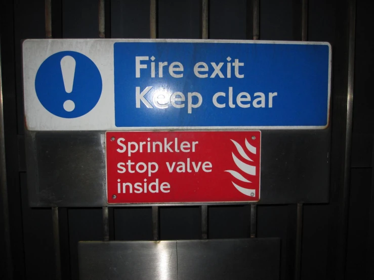 a sign warning people to fire exit and keep clear