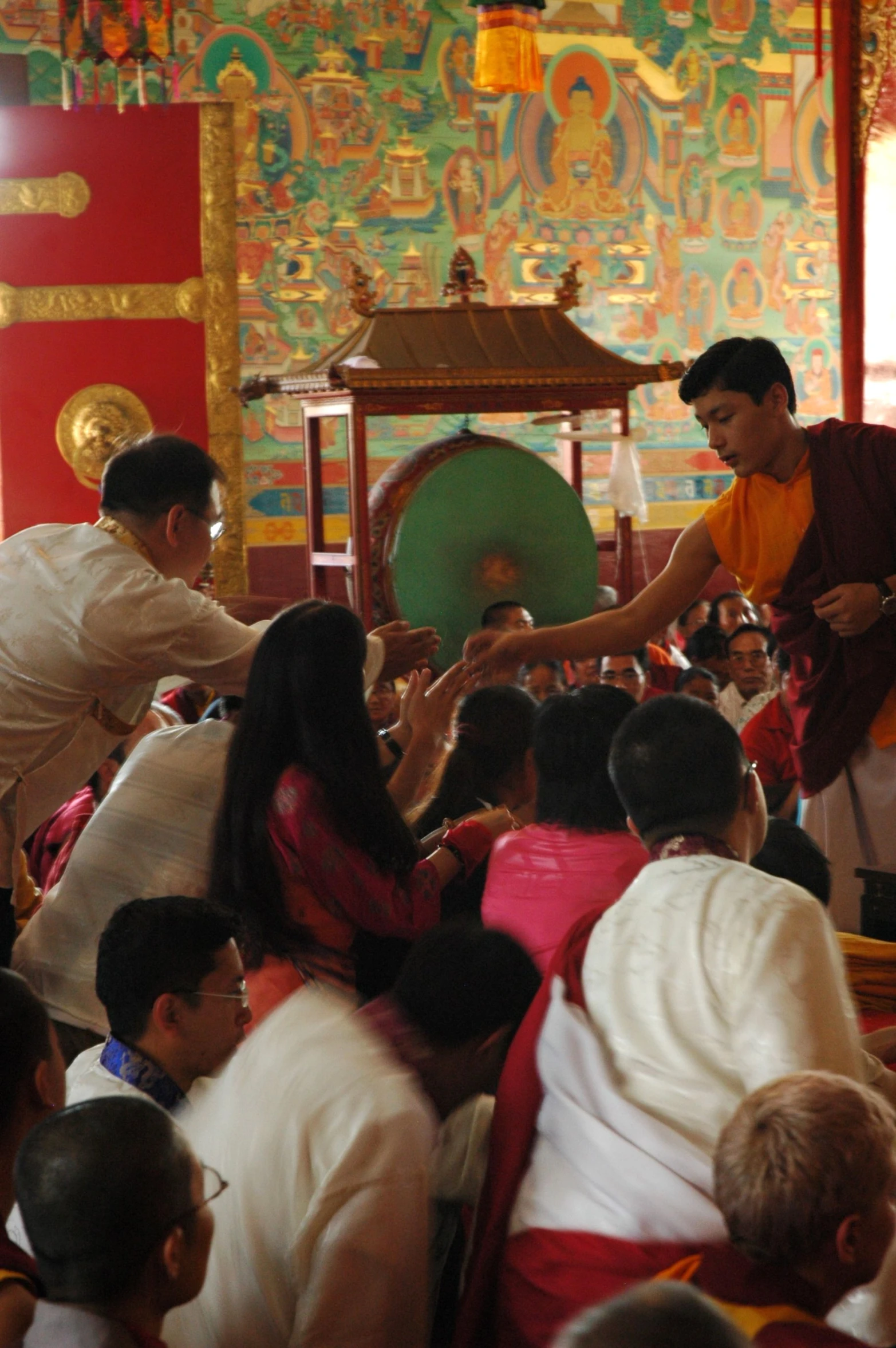 the men are standing and holding hands in front of the audience