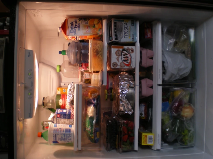 an open refrigerator containing food and drinks