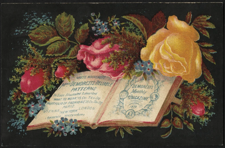 an old, well - used book with flowers and leaves