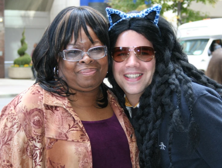 two women posing with their cats ears on