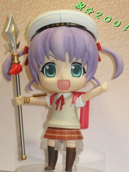 a toy doll holding a sword and a piece of glass