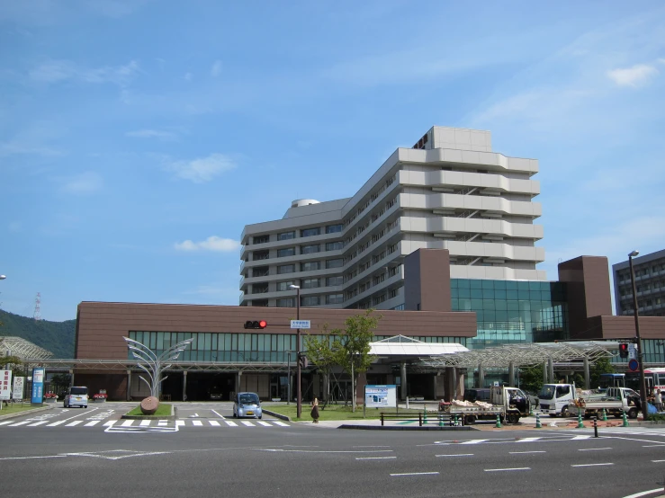 an empty parking lot with many buildings in the background