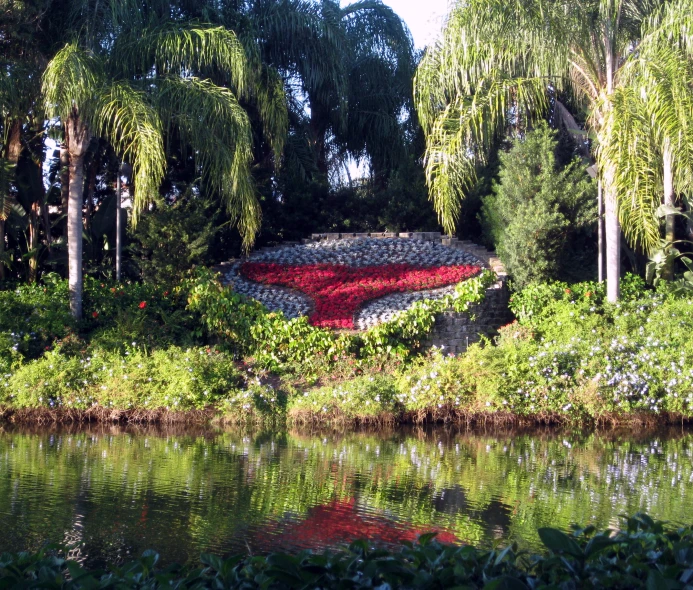 a giant mushroom covered in flowers in the jungle