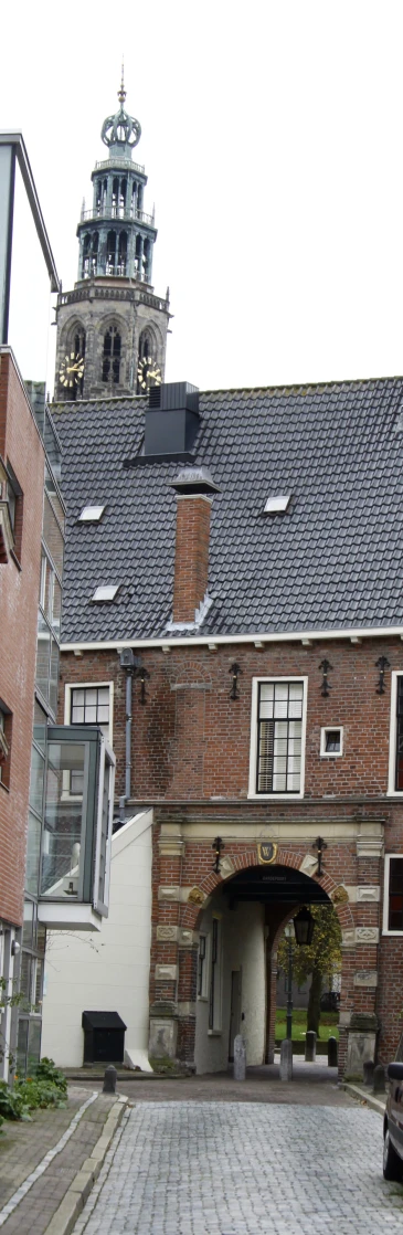 the building has a big gate between it and two buildings