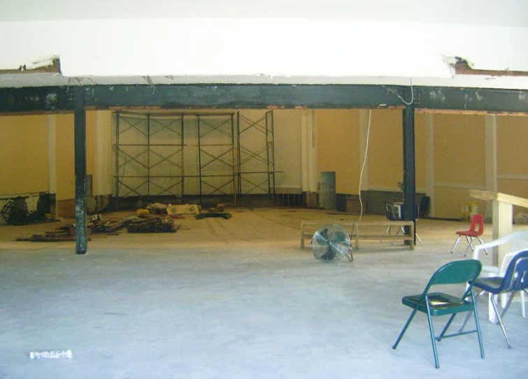 chairs sitting on the ground in a large room