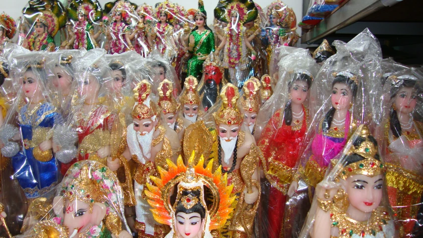 large group of dolls with clothes, costumes and tiara