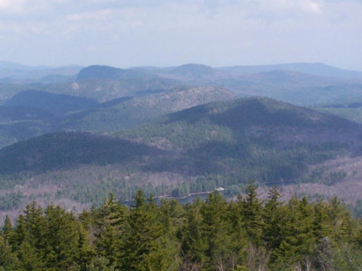 a distant view of the forested mountains and forests