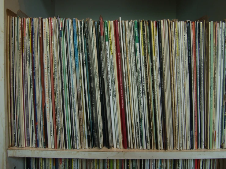 there are many record disks on the shelf