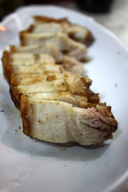 pork slices on a plate on the table