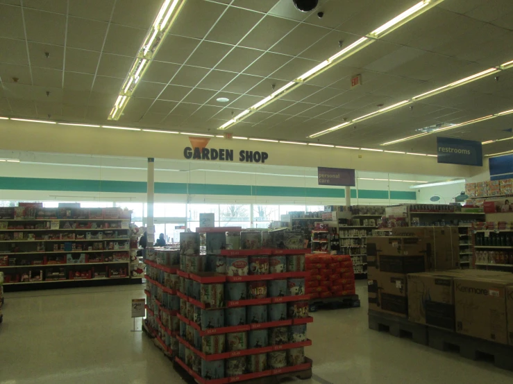 the grocery store aisle is very wide and empty