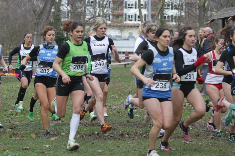 a group of women are running in a race