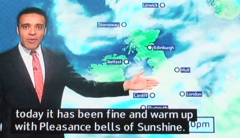 a man giving a presentation to tv news on weather