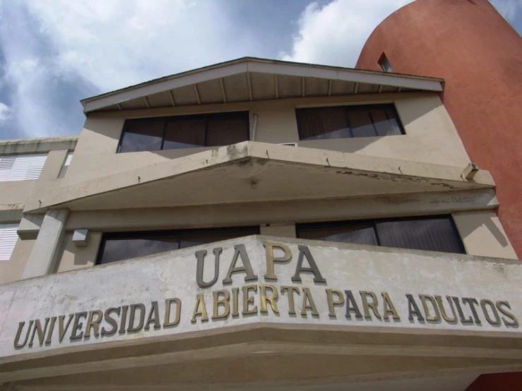 an old building with a sign above it saying uap