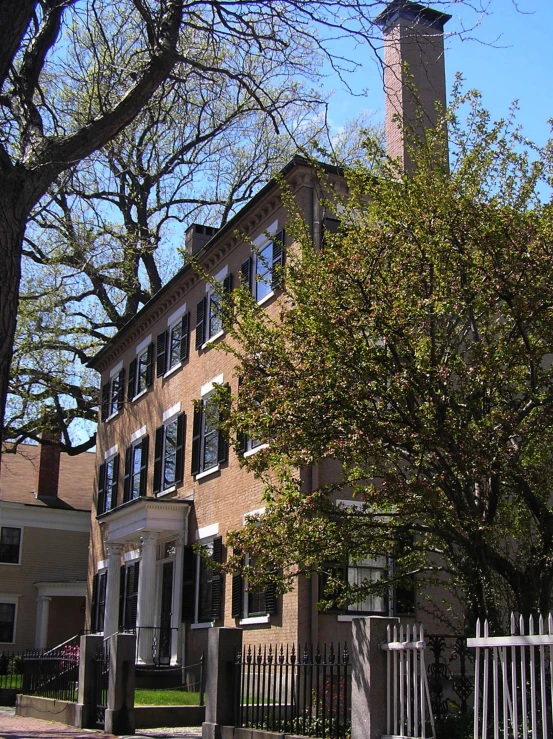 a view of a brick building with large windows