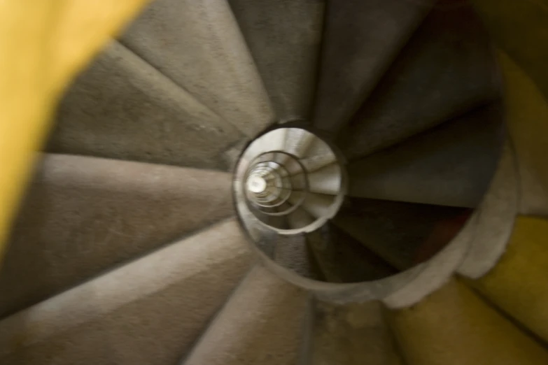 a close up view of an old, circular fire escape