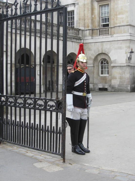 two soldiers standing by the gates of a building