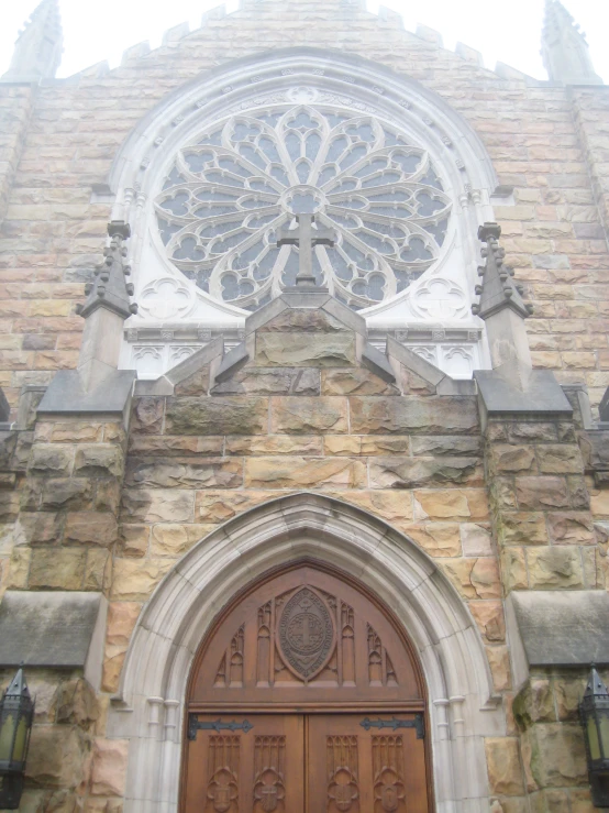 an old church has an intricate decorative doorway