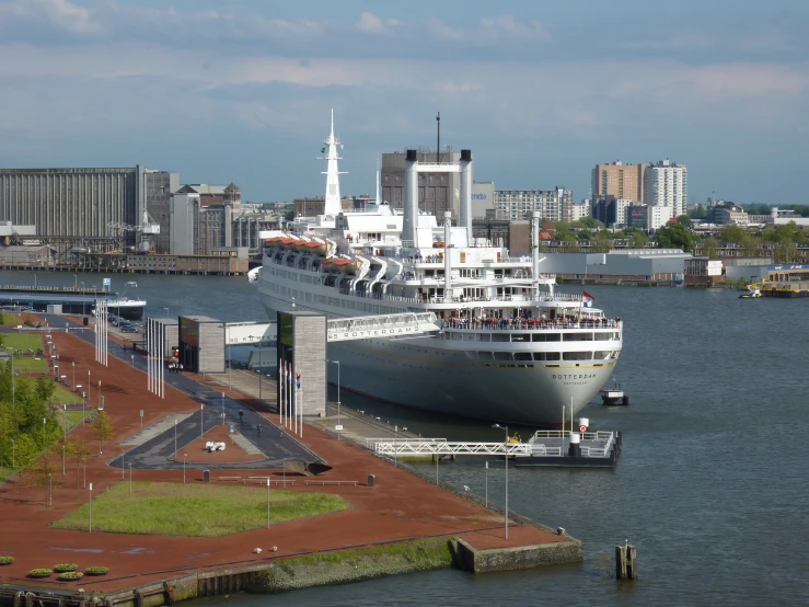 a big boat docked on the water in a large body of water