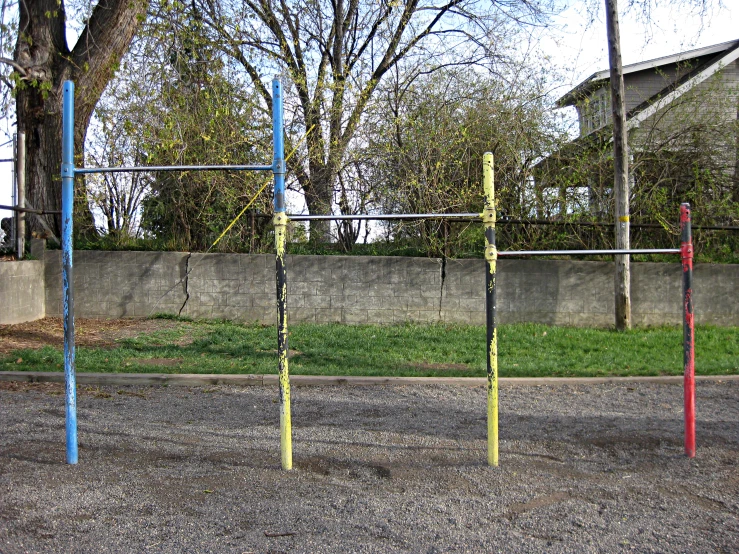 the tall poles are colored bright red, blue and yellow
