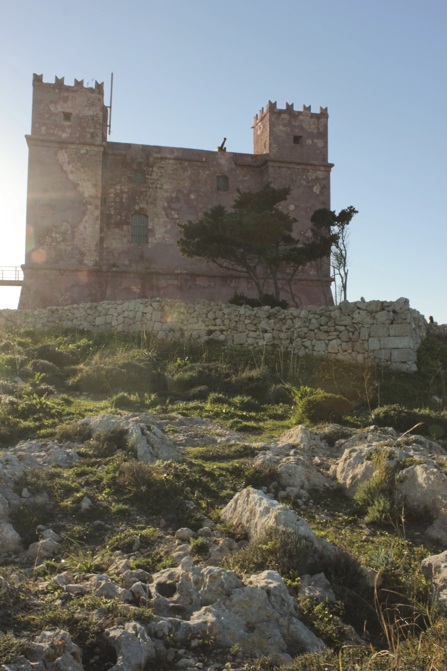 a small building that is on top of a hill