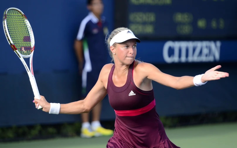 a female tennis player swinging her racket