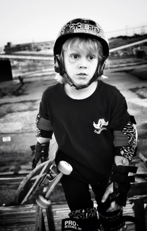 a little boy is wearing some kind of helmet and goggles