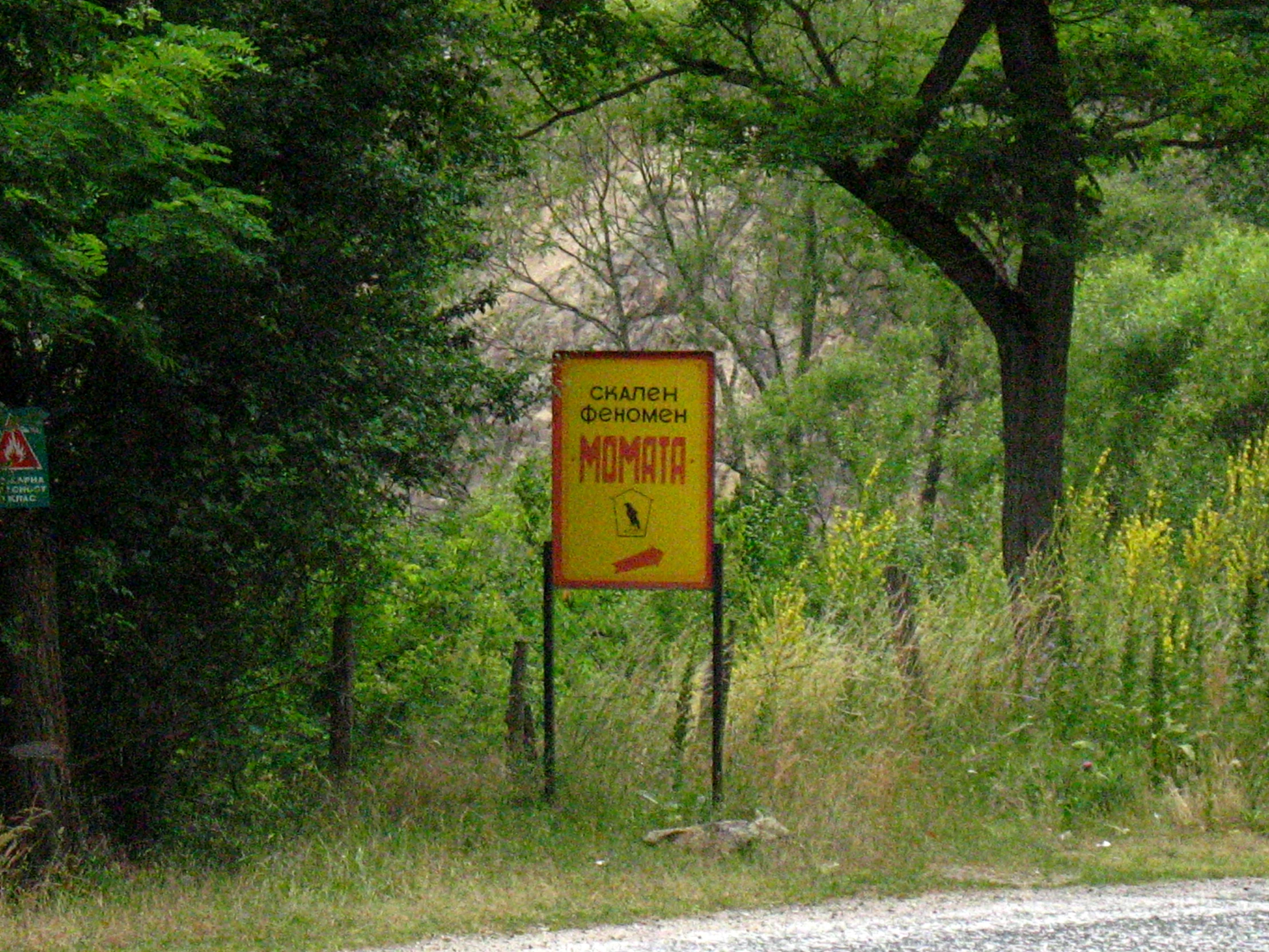 the sign is beside the road warning of danger