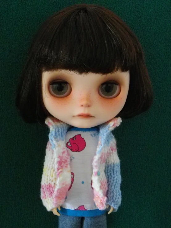 closeup of a toy doll wearing an adorable clothing