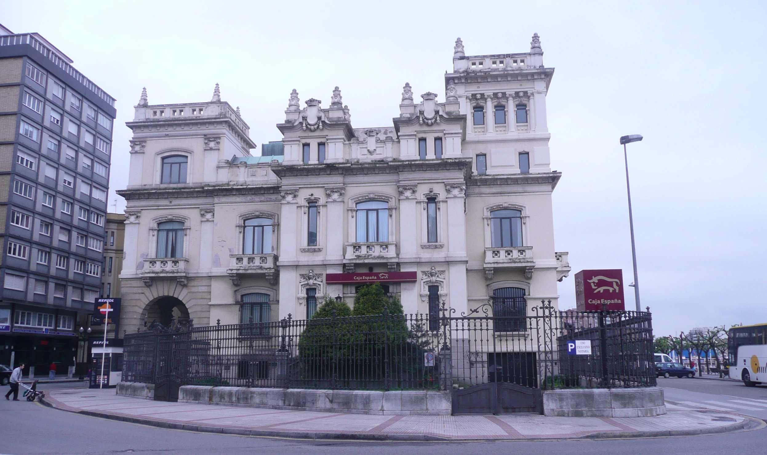 an old building sits at the end of the street