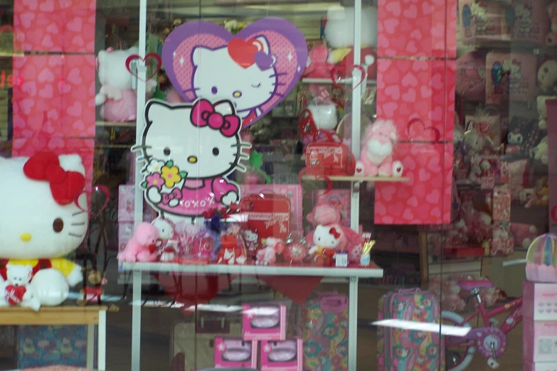 there are hello kitty and other items in the window