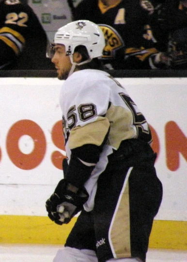 a hockey player moving along the ice in a game