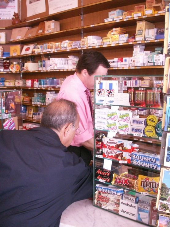 two men working together in a store