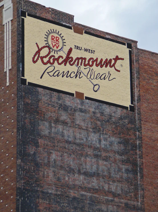 a large sign hanging from the side of a building