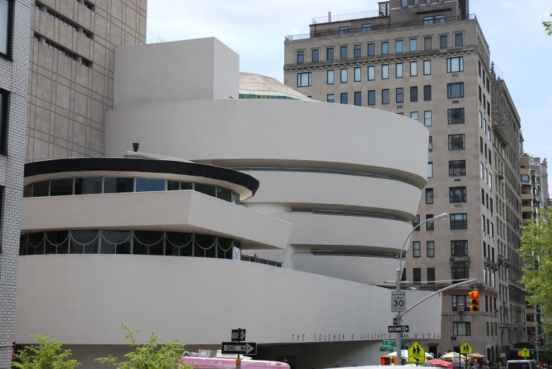 a very modern architecture looking building near some tall buildings