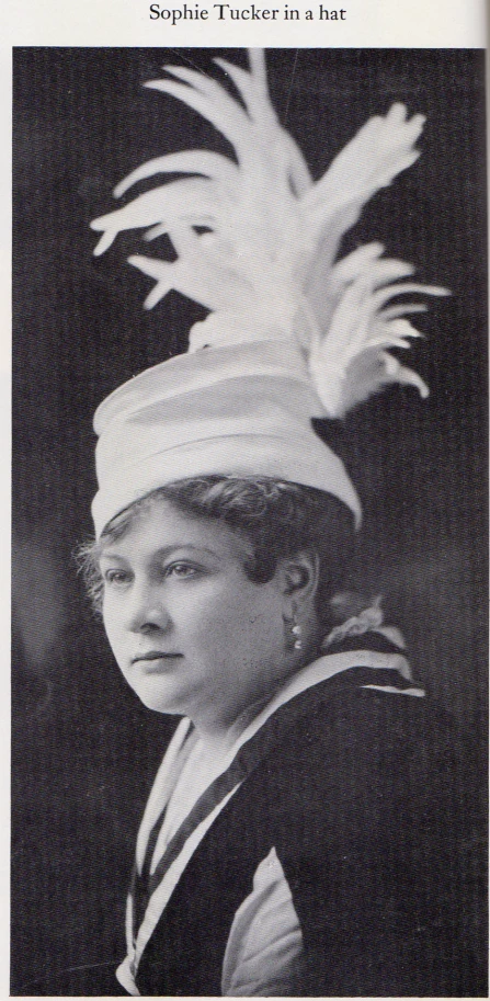 an image of woman in costume with feathers