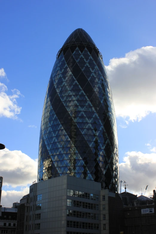 a building with a curved glass front on top