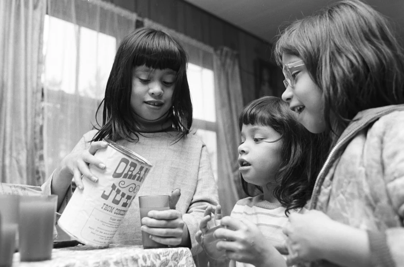 three s look at papers in front of the table