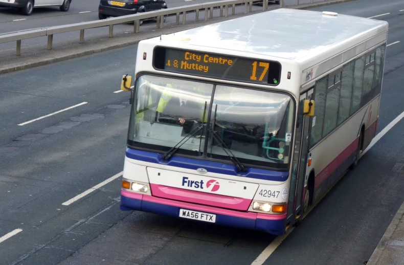 a bus is traveling down a busy highway