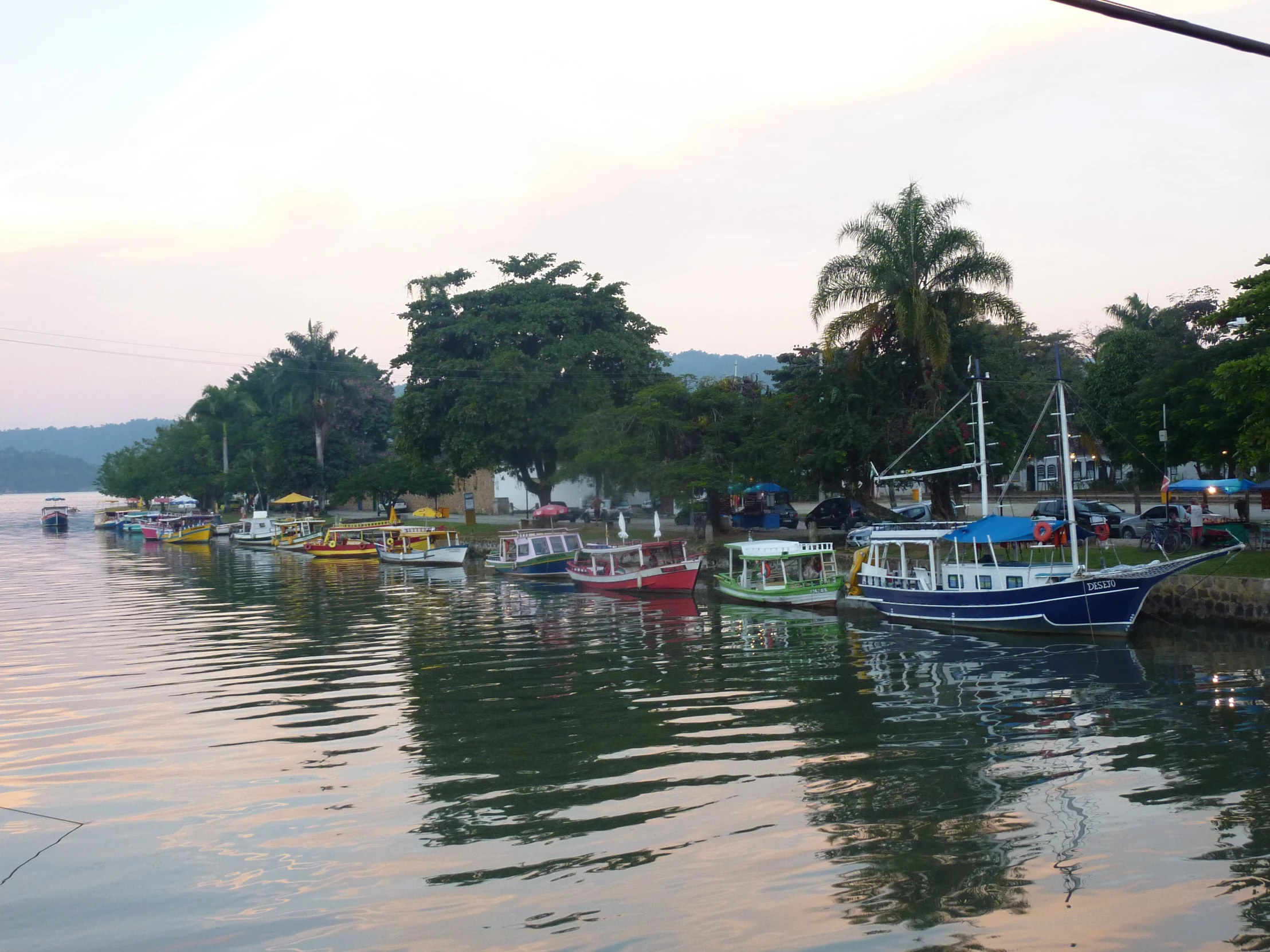 boats in a harbor during the evening at sea