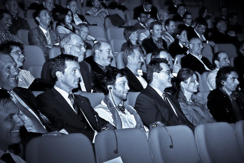 many people are in chairs looking up and having fun