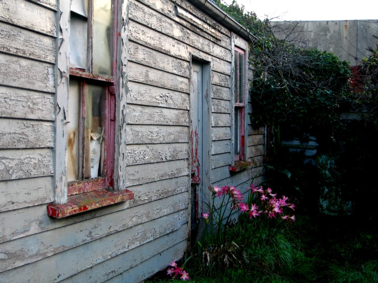 a broken down house that is outside of it