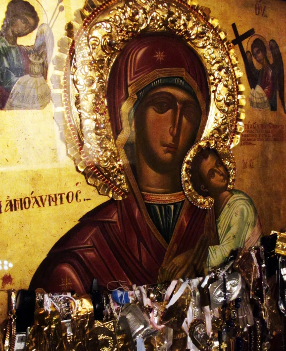 the icon is on display with many other religious items around