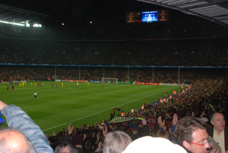 there are many fans watching a soccer game