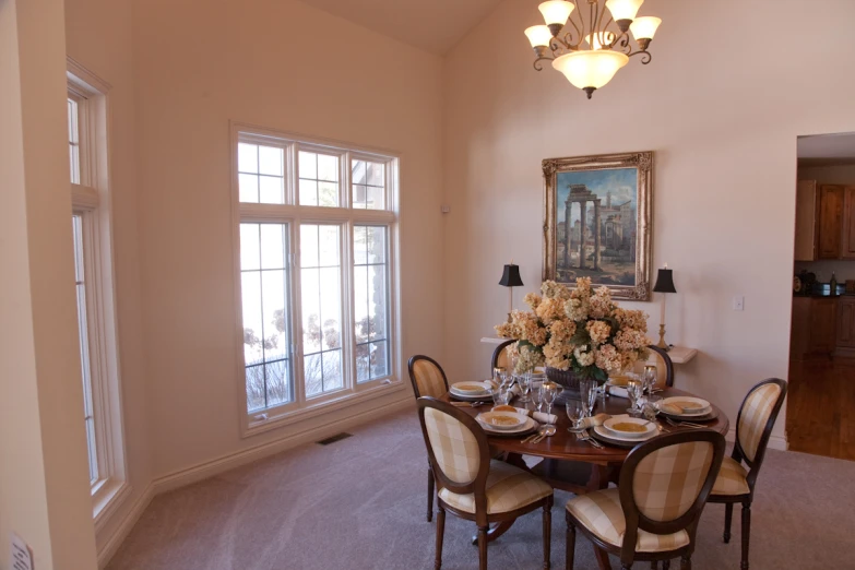 the dining room has a very large table in it