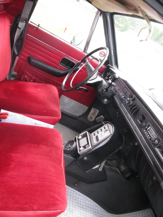 the view inside a car shows a dashboard, steering wheel and seats